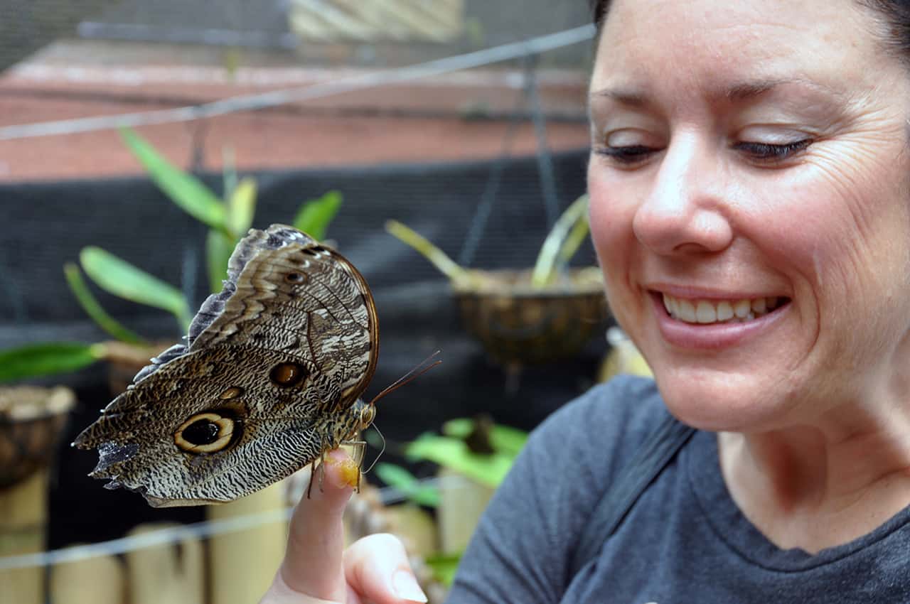 Kim with a friend at the butterfly preserve