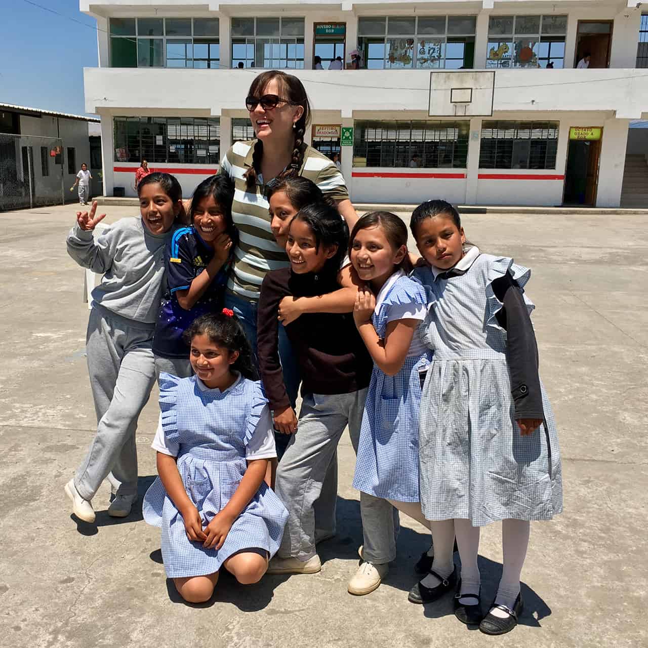 Mary with local schoolkids in Ecuador