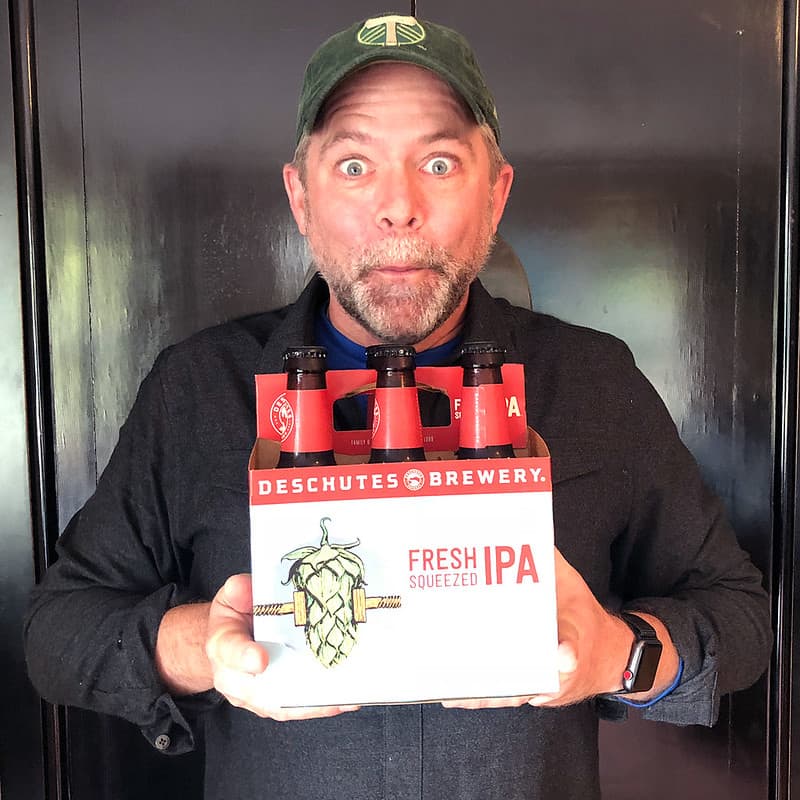 J.D. with a six-pack of his favorite beer