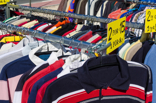 Clothes on rack at yard sale