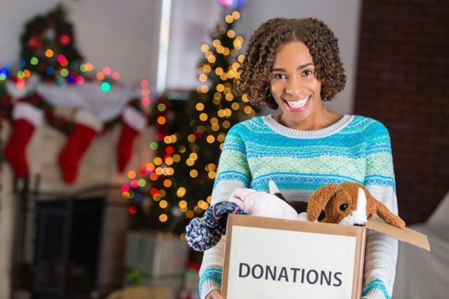 Woman gathering toys to donate after Christmas