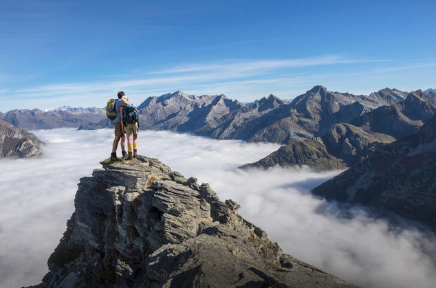 couple standing on mountain